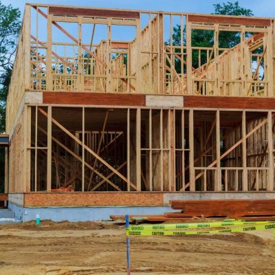 House under construction upward view through residential, wood construction framing for a house