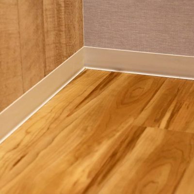 Wooden floor and wall with skirting boards